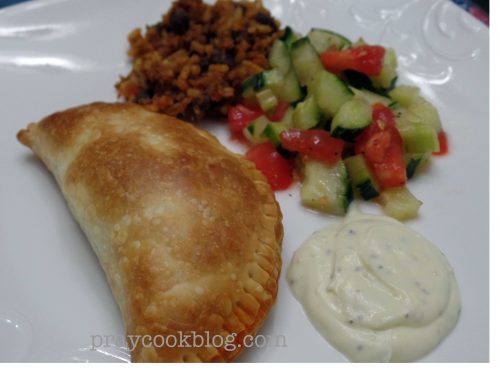 Plate Empanada and cuc tom salad